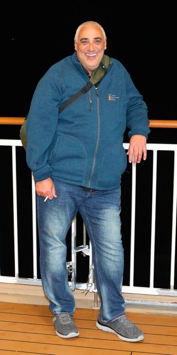 Samy on a marina dock, visibly leaner