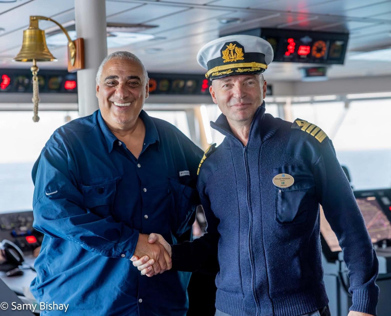 On the bridge, handshake with the captain